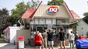 People stand in line outside of the Dairy Queen at 1138 Walker Ave. on Tuesday, July 18, 2023 in Grand Rapids. (Ridley Hudson | MLive.com)