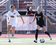 Lexi Dendis (3) of Hunterdon Central moves the ball past Shivani Howe (19) of Watchung Hills during the girls soccer game at Hunterdon Central Regional High School on 9/8/22.