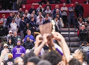 The Manasquan boys basketball team watches from the crowd at Rutgers as Camden holds up the NJSIAA Group 2 boys basketball championship trophy after they beat Newark Arts, 69-50, Saturday, March 9, 2024, in Piscataway, N.J.