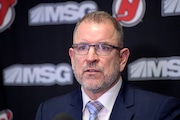 New Jersey Devils general manager Tom Fitzgerald announces the Devils signed Jack Hughes to an eight-year $64 million extension before an NHL hockey game against the San Jose Sharks Tuesday, Nov. 30, 2021, in Newark, N.J. (AP Photo/Bill Kostroun)