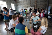 Attendees sit and chat in one of the siting areas during The Jersey Eats: A Taste of North Jersey event at 18 Label Studios in Montclair on Sunday, September 17, 2023.