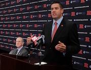 Rutgers University Director of Athletics Tim Pernetti speaks during a press conference announcing Rutgers announces a move to the Big Ten on Tuesday, November, 20, 2012,  ending a two-decade relationship with the Big East.  Seated from left: Big Ten Commissioner James E. Delany and Rutgers University President Robert Barchi.  The decision to defect from the Big East, of which Rutgers has been a member for football since 1991 and for all sports since 1995, comes on the heels of the University of Marylandâ€™s governing board unanimously voting to leave the Atlantic Coast Conference and join the Big Ten.

(Patti Sapone/The Star-Ledger) SL