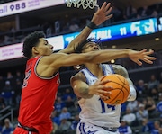 Seton Hall Pirates guard Dre Davis (14) is fouled by RJ Luis Jr. (12) of St. John’s (left) during the first half, Tuesday, Jan. 16, 2024 in Newark, N.J. 
